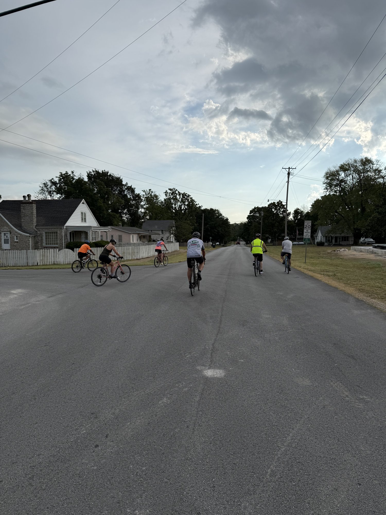 Country Miler 2026 — a pack of riders rolling through a neighborhood stretch