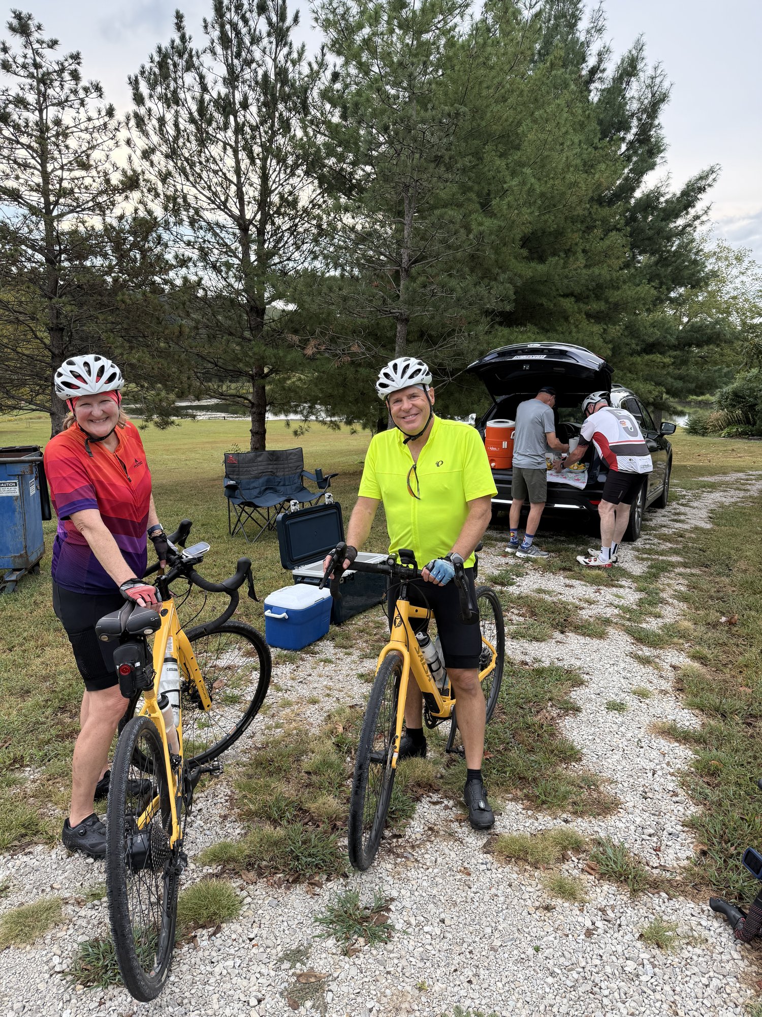 Country Miler 2026 — two riders hanging out with bikes on a gravel stretch