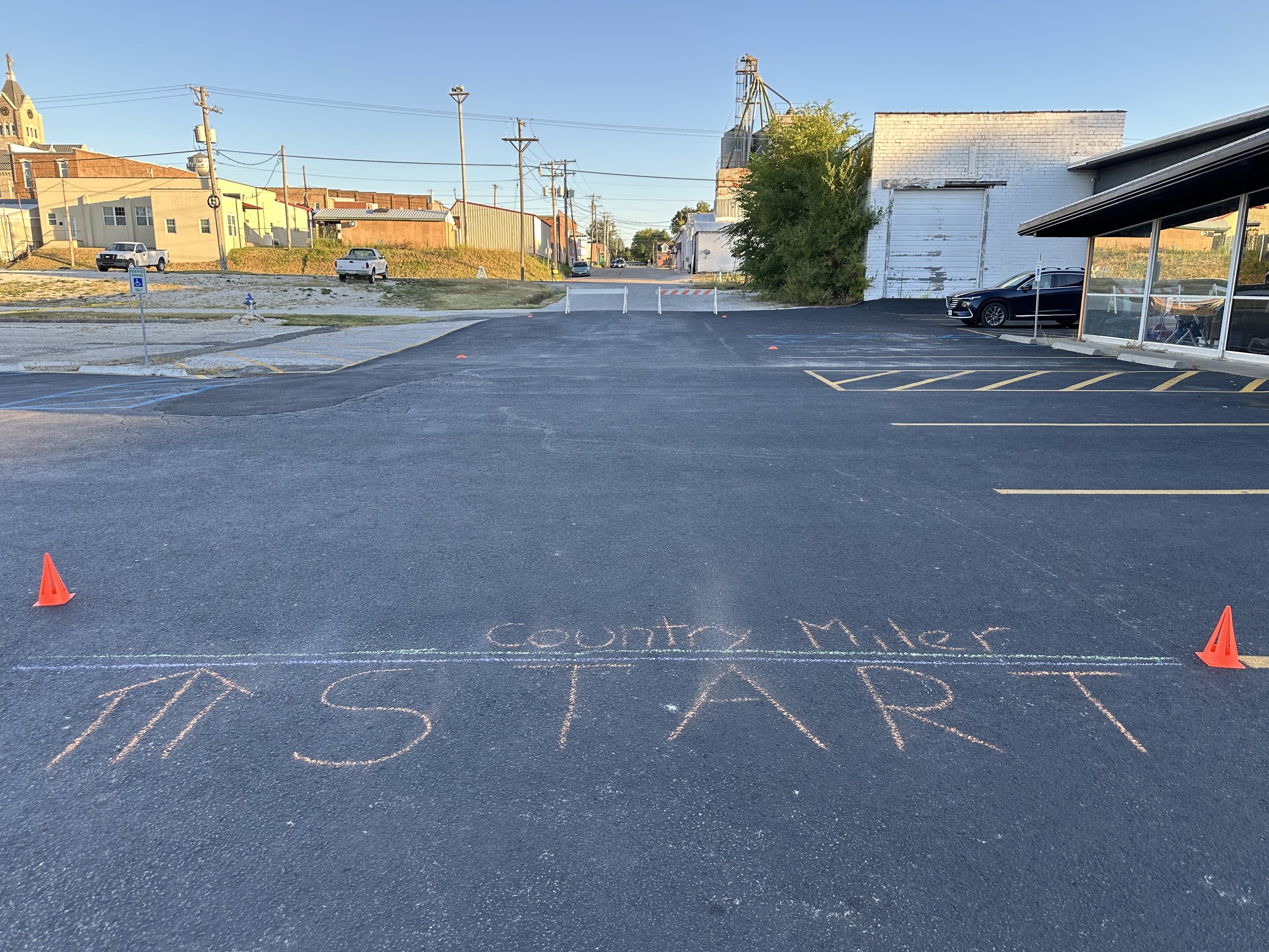 Chalk START and Country Miler line on pavement at the event start