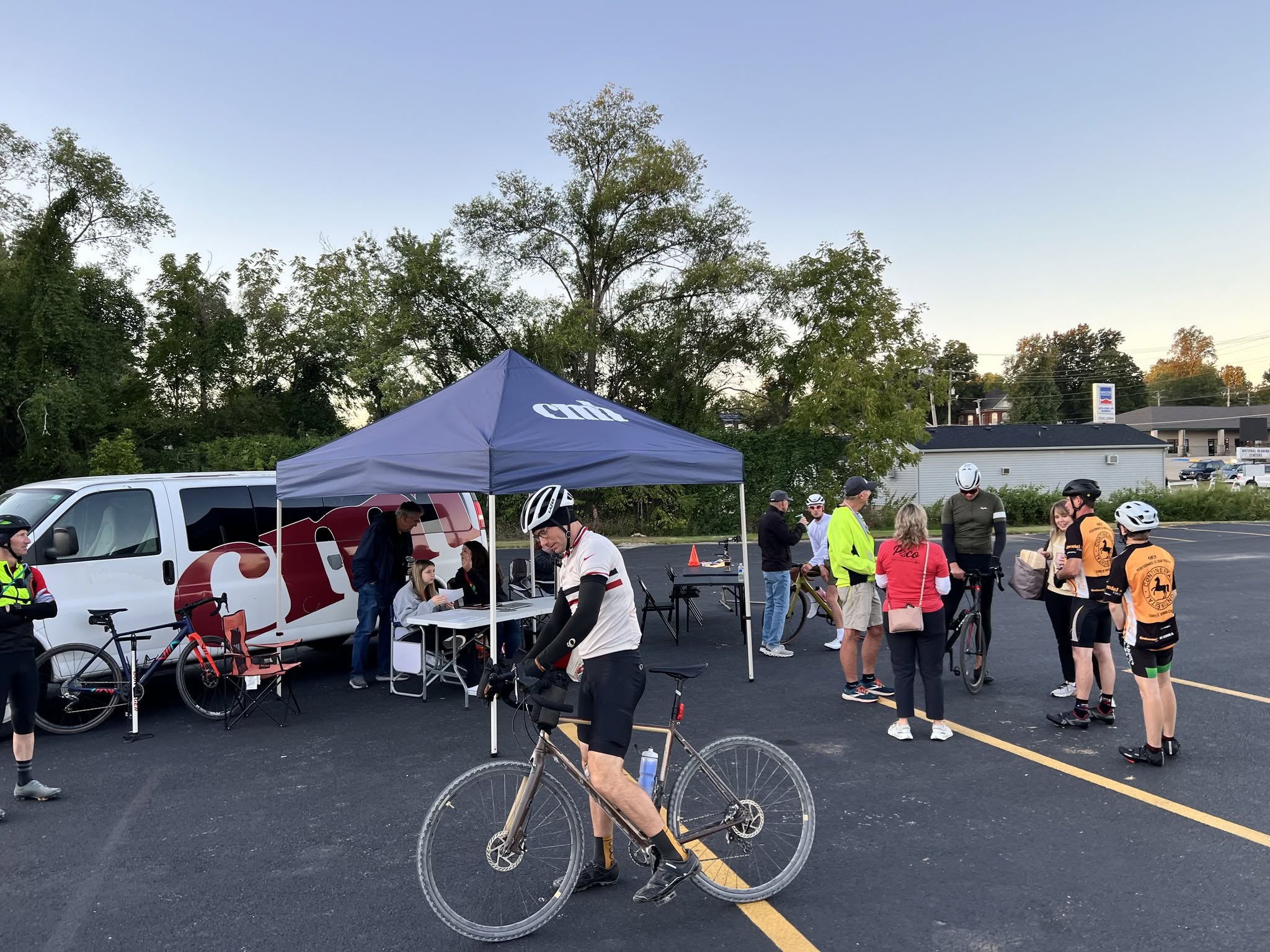 Cyclists at the Country Miler start near the CNB tent