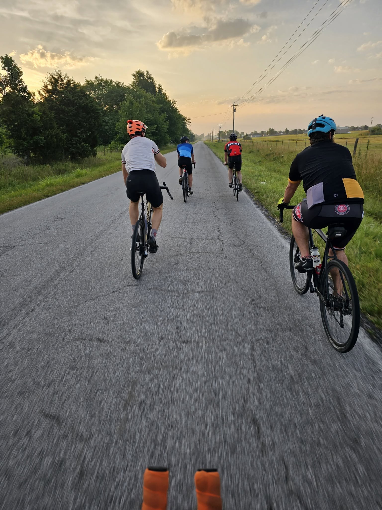 POV of riders on a Polk County country road at golden hour